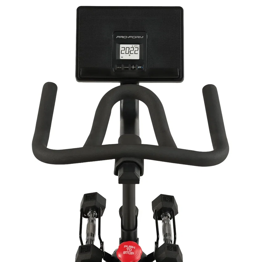LCD console, device shelf and dumbbells on the ProForm indoor cycle