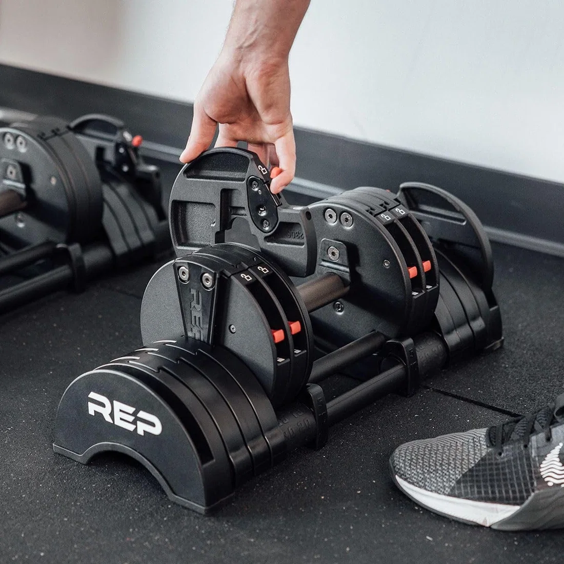 REP QuickDraw Adjustable Dumbbells in gym setup