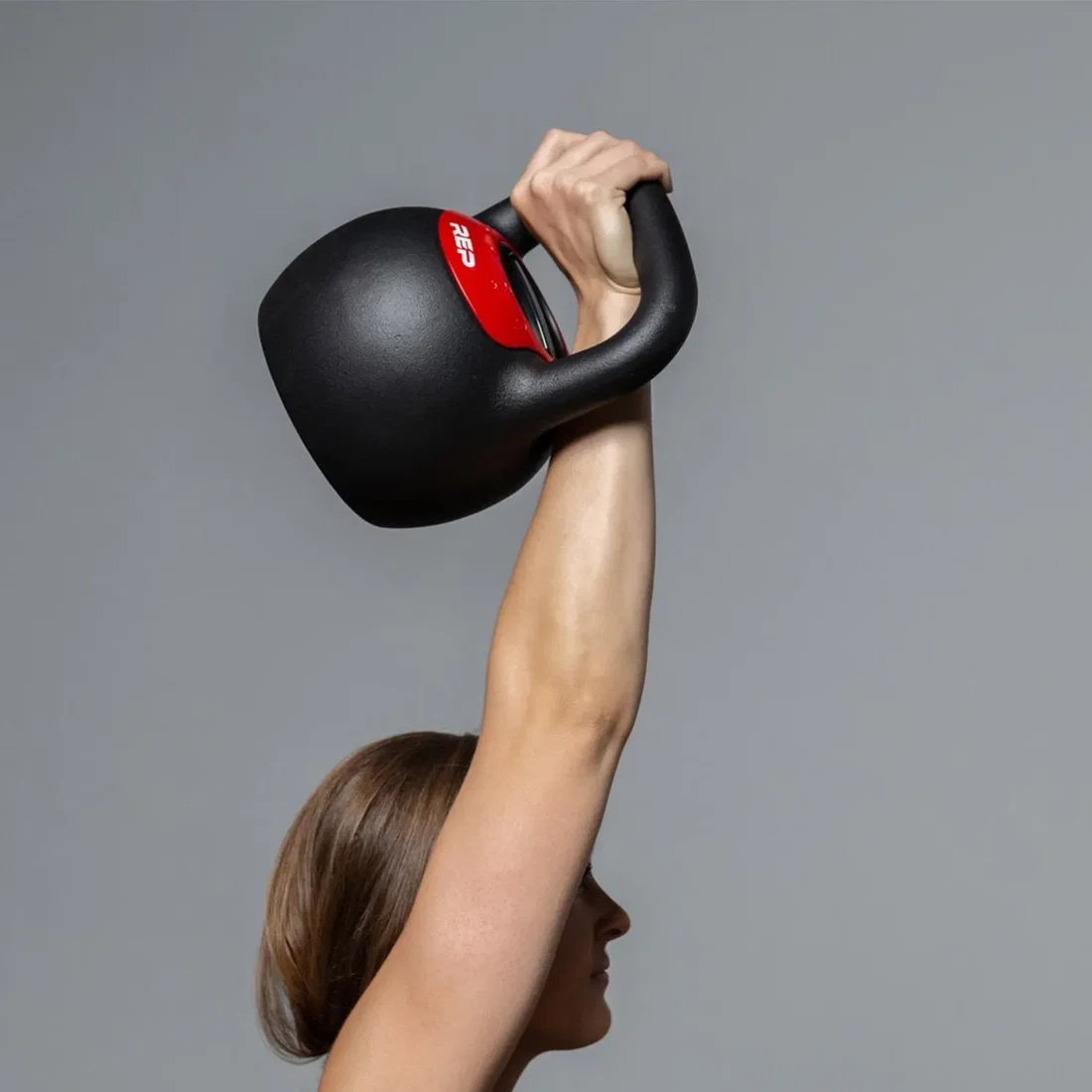 Athlete training with REP Fitness Adjustable Kettlebell